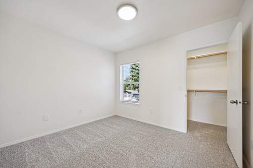 A room with a window and a door.