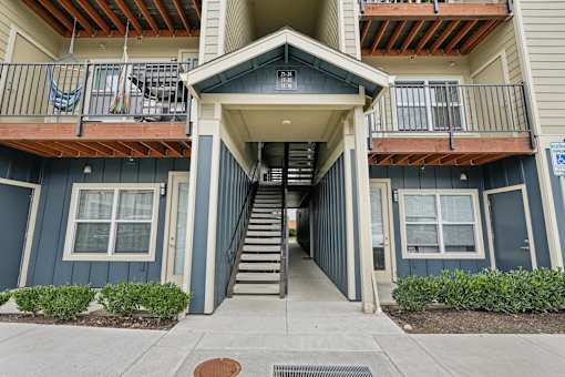 A building with a staircase leading to the entrance.