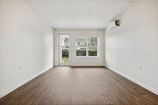 A room with a door and a window.