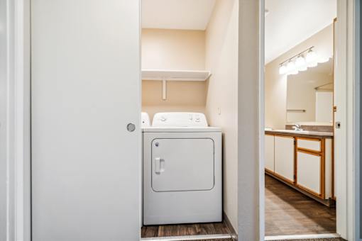 A white fridge in a small kitchen.