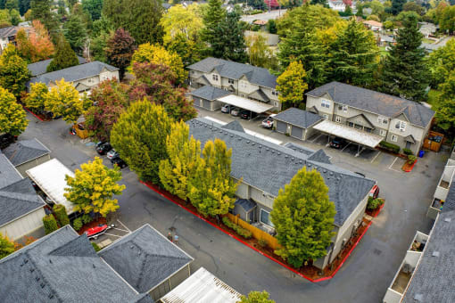 an aerial view of a neighborhood with houses and trees