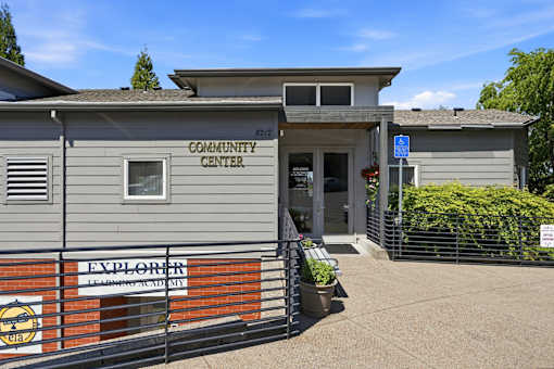 A grey building with a sign that says Community Center.
