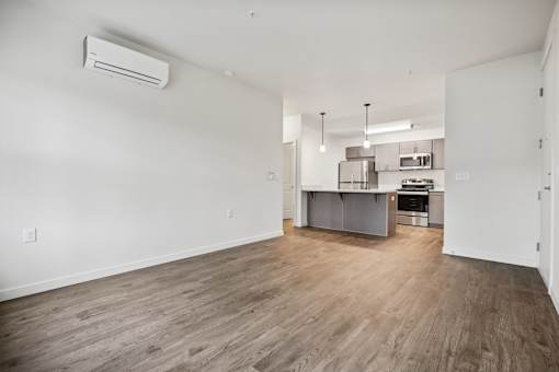 A kitchen area with a counter and cabinets.