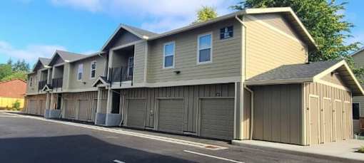 A row of houses with attached garages.