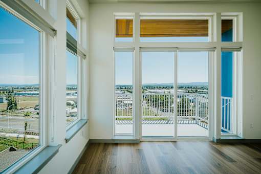 Grand Vista Apartments Living Room with Balcony View