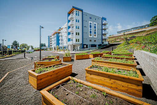 Grand Vista Apartments Exterior Building with Community Garden