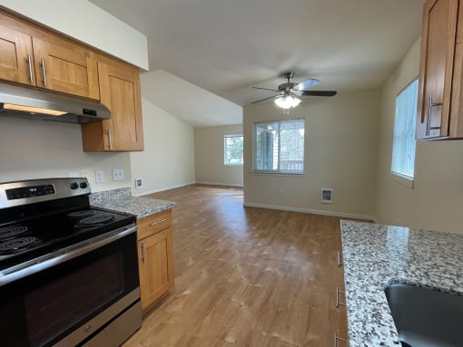 a kitchen and living room in a house