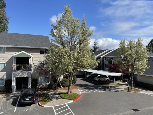 a parking lot with a car parked in front of a building