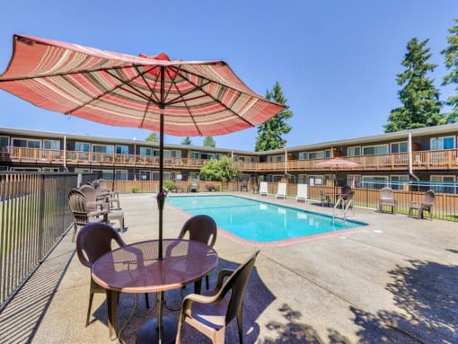 Pool deck with table and chairs