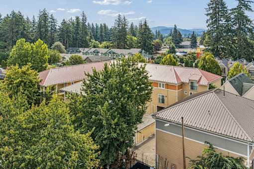 A view of a residential area with houses and trees.