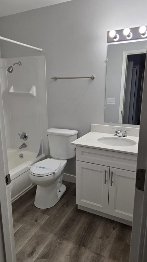 a small bathroom with a toilet sink and shower