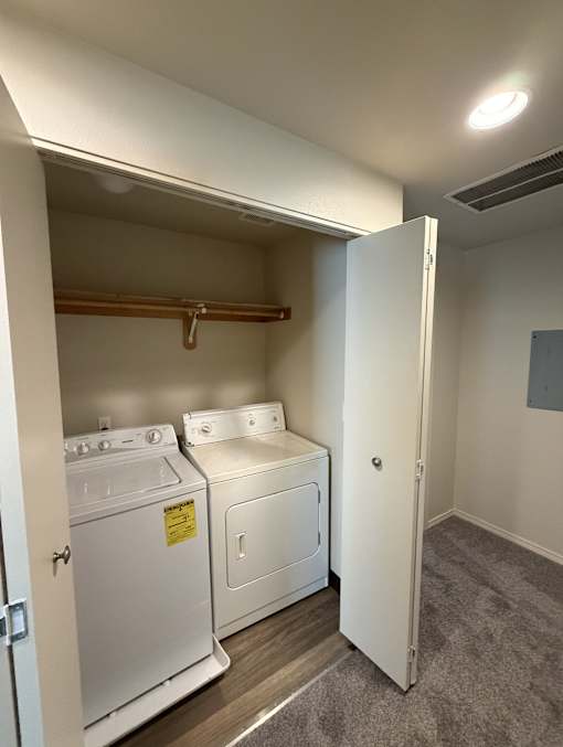 A laundry room with a washer and dryer.