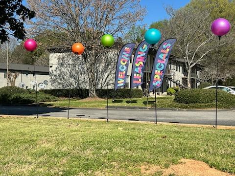 a street with a bunch of balloons on the side of it