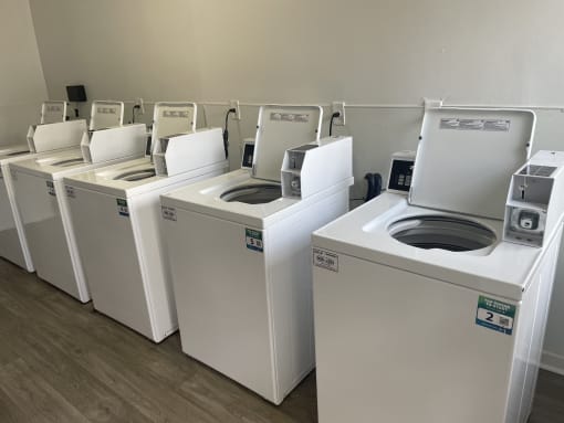 a row of washing machines in a laundromat
