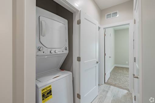 A washer and dryer in a small laundry room.