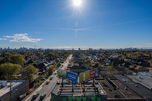 A sunny day in a city with a clear blue sky.
