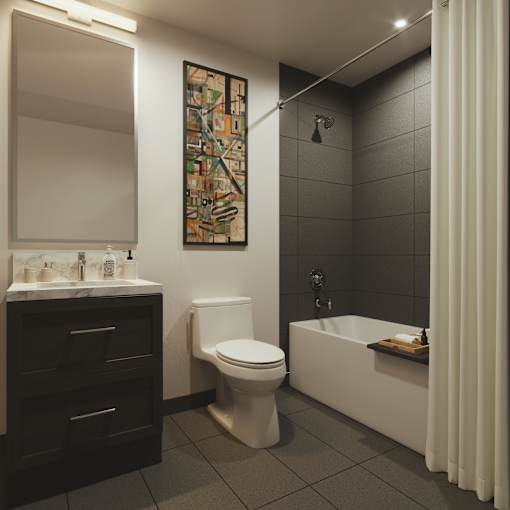 A bathroom with a toilet, sink, and bathtub.