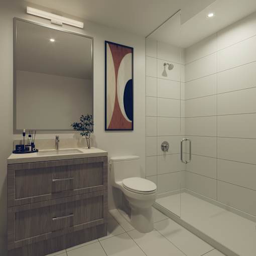 A modern bathroom with a white toilet, a sink, and a shower.