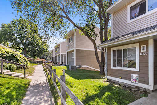 A residential area with houses and a clear sky.
