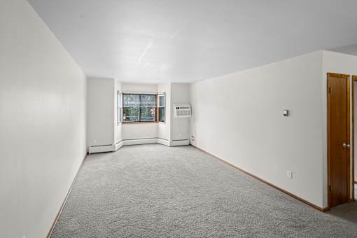 A room with a window and a door.
