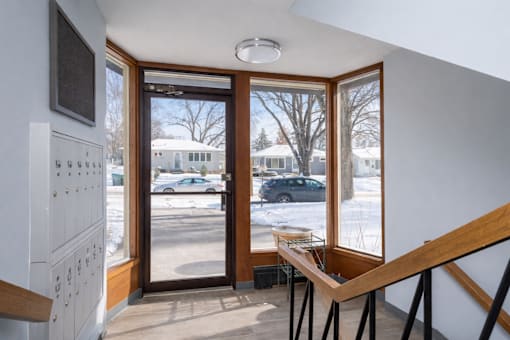 A view from inside a house looking out through a glass door.
