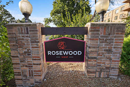 a sign at the entrance to rosewood sign
