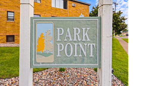 A sign that says Park Point in front of a building.
