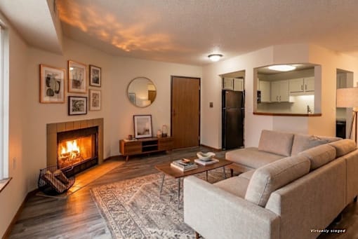 A living room with a fireplace and a couch.
