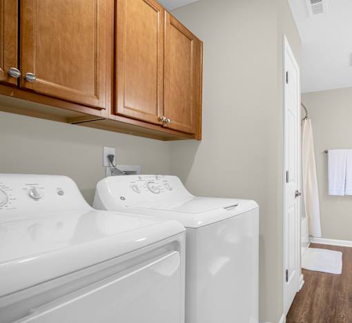 A washer and dryer in a laundry room.