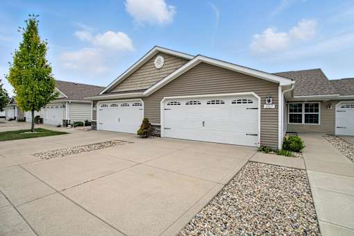 A house with a garage and a driveway.