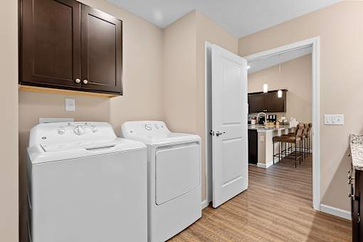 A laundry room with a washer and dryer.