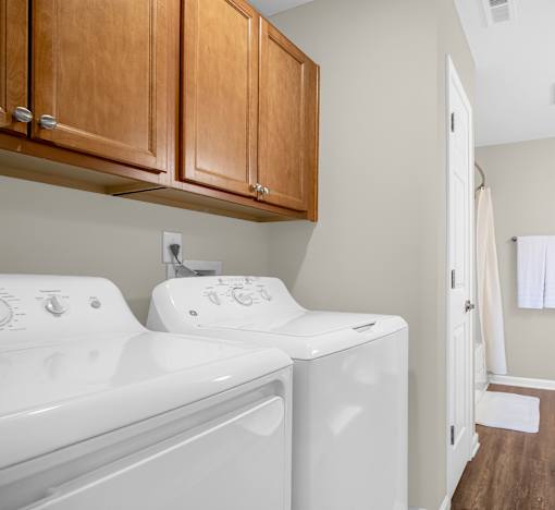 A washer and dryer in a laundry room.