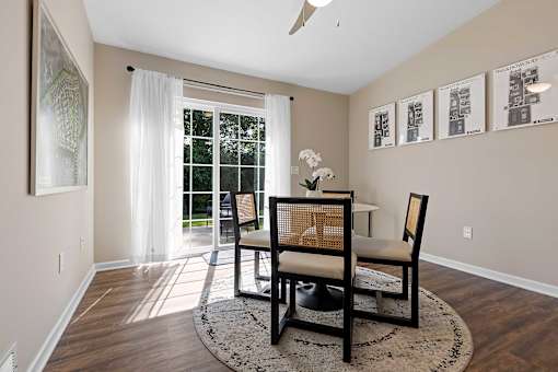 A room with a table and chairs in it.