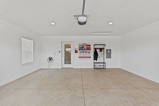 A room with a white wall and a white door.
