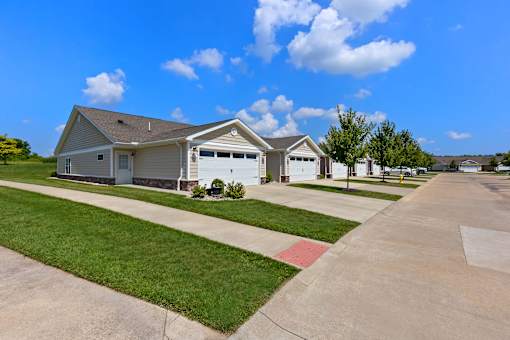 A house with a driveway in front of it.