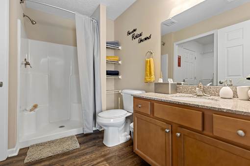 A bathroom with a white toilet and a white sink.