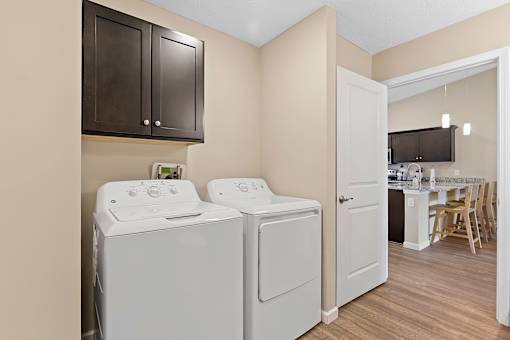 A laundry room with a washer and dryer.