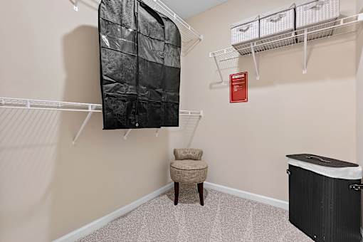 A baby room with a crib and a chair.