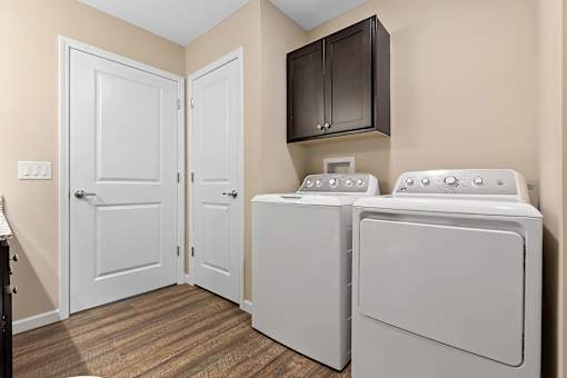 A laundry room with a washer and dryer.