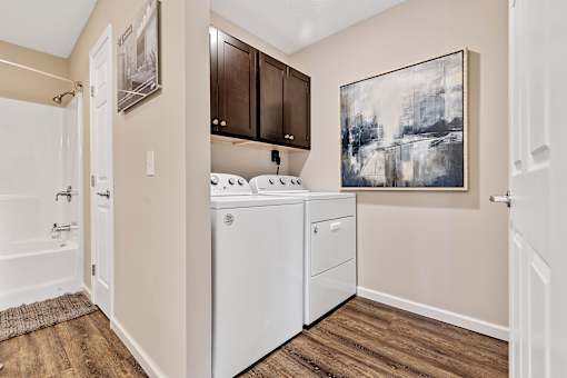 A laundry room with a washer and dryer.