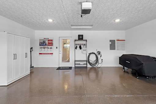 A room with a white ceiling and a black object on the floor.