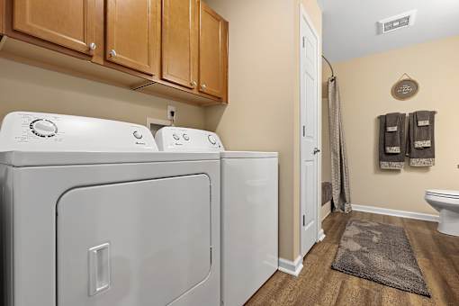 A laundry room with a washer and dryer.