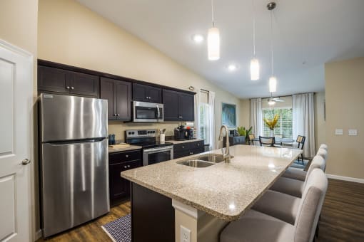 a kitchen with stainless steel appliances and a granite counter top