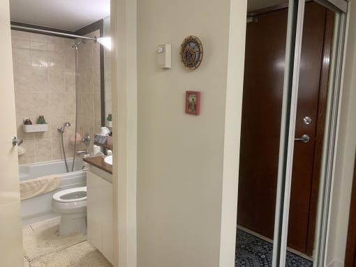 a bathroom with a shower toilet and sink
