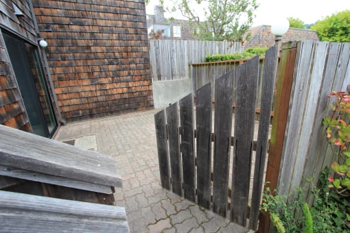 a garden with a wooden fence