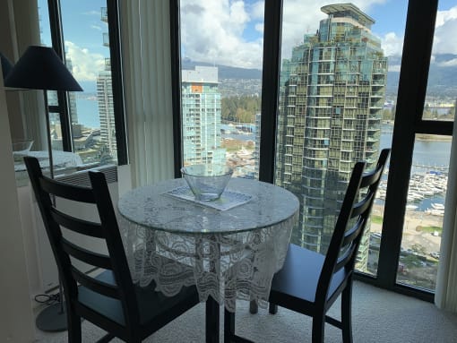a dining room table with a view of the city