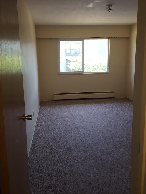 an empty room with a large window