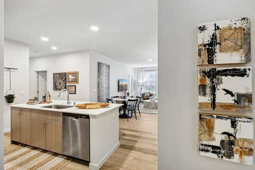 a kitchen with a sink and a counter top in a house