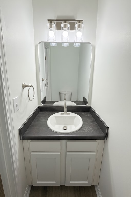 A bathroom sink with a mirror above it.