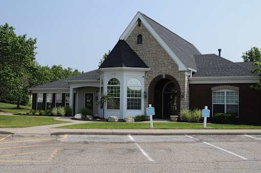 A building with a parking lot in front of it.